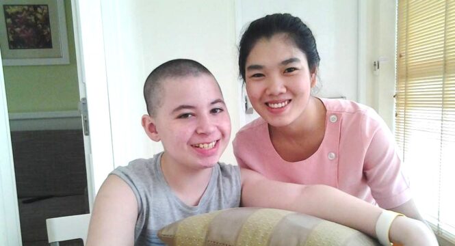 CP patient Renzo with nurse during stem cell treatment